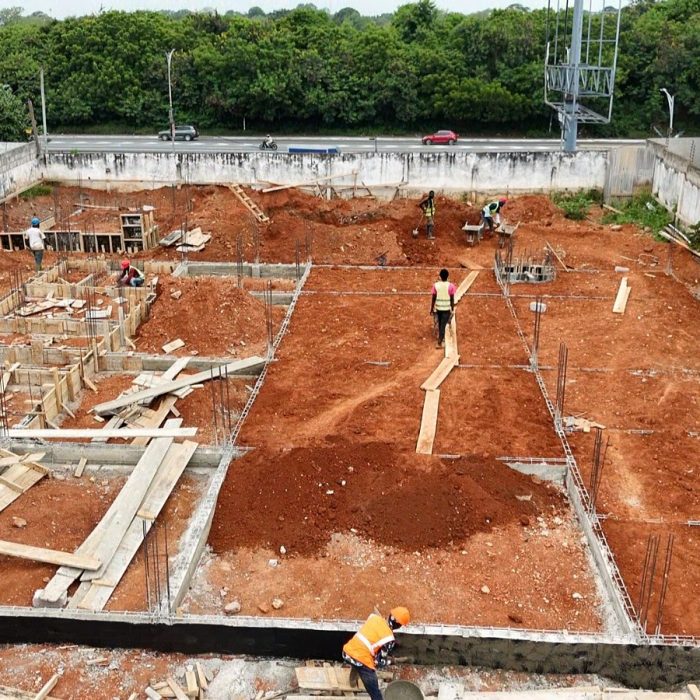 Progress update showing ground-floor blockwork walls rising at a multi-story building site in Abelemkpe