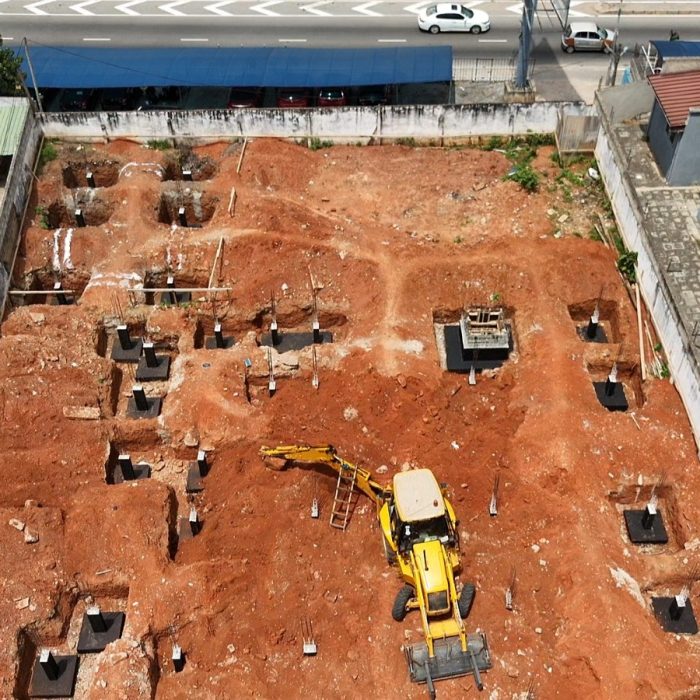 Progress update showing ground-floor blockwork walls rising at a multi-story building site in Abelemkpe